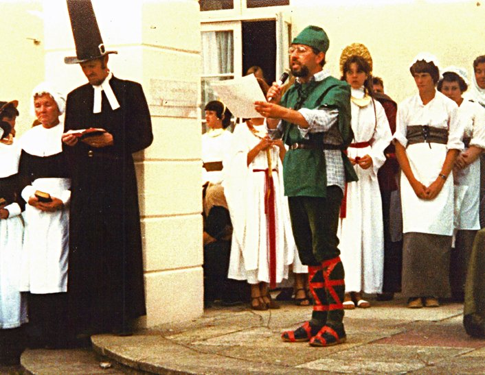 Rev Anthony Geering proclaiming at the first Pilton Festival in 1982