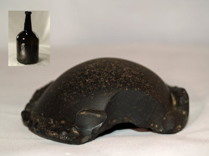 An 18th Century black blown glass mallet bottle found in Bradiford Water 
